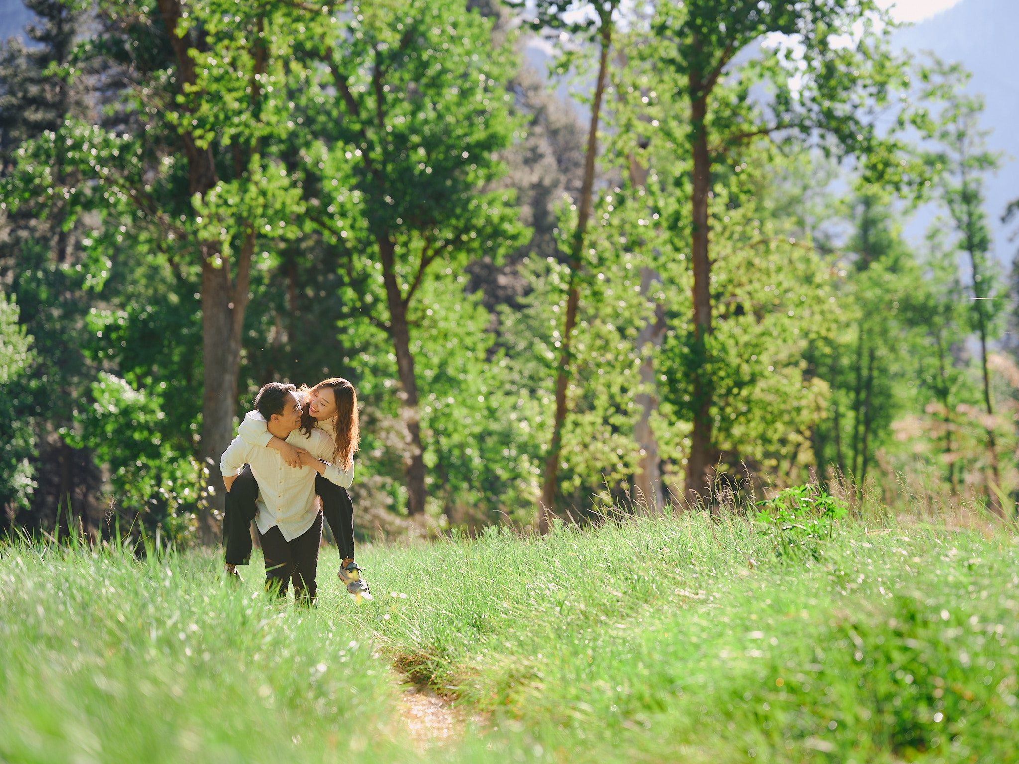 Couple in a green forest