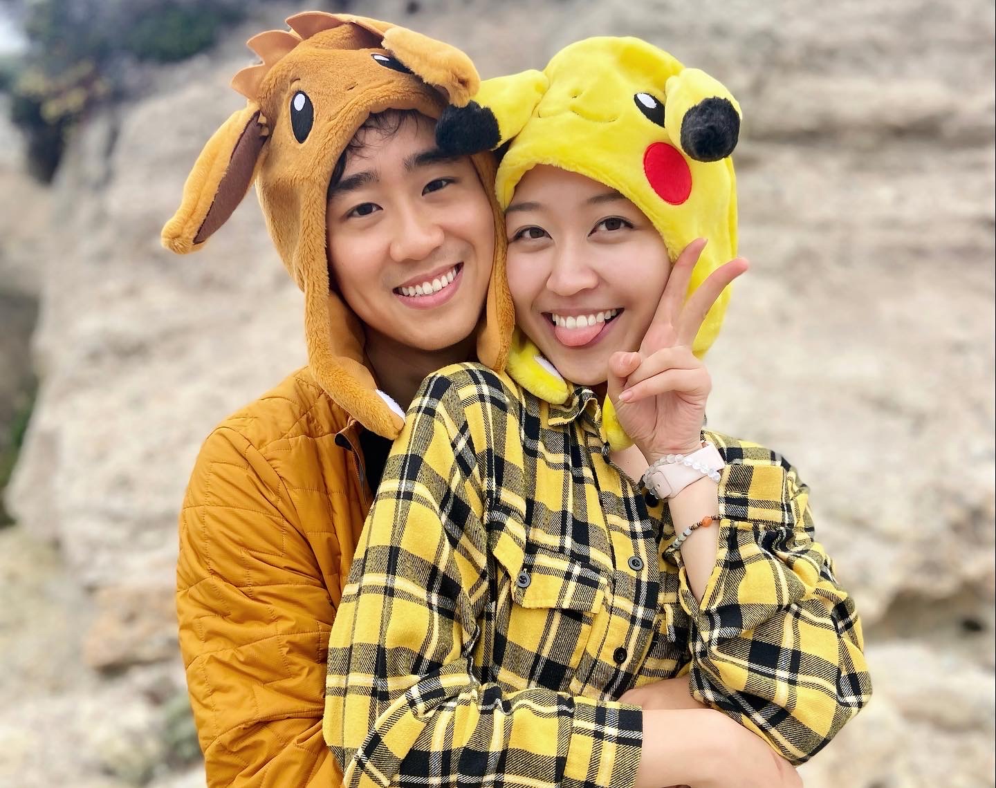 Lina and Kevin in playful character hats